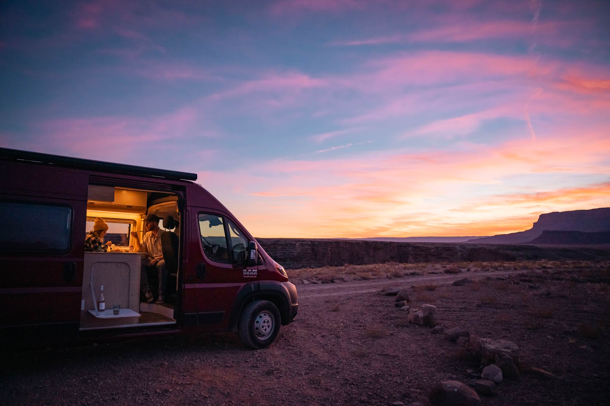 Van in the southwest desert at sunset